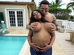 A busty black woman that has plump tits is getting licked and penetrated
