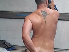 Erotic muscular athlete takes a shower after the gym and cums