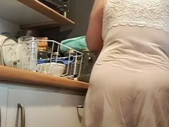 Wife with transparency in the kitchen having breakfast