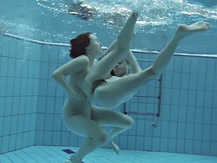 Two hot hairy babes underwater