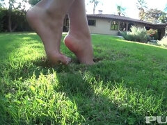 Kayla takes a barefoot walk around her backayard