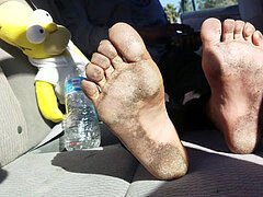 Homeless japanese doll with dirty feet