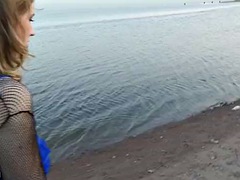 Girl in fishing nets blowing