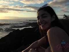 Emily enjoys the shoreline, and a sunset.