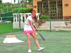 Redhead is playing tennis and getting naked to play with balls