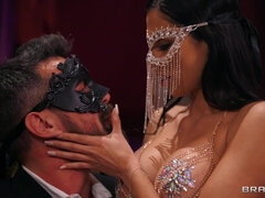 Masked dude invites a busty brunette to ride his cock