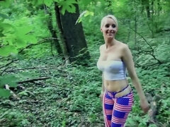 Short-haired blonde girl is sucking some cock in the woods