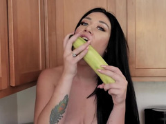 Depraved brunette is rubbing her pussy with a banana