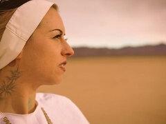 Slutty nun Ivizia Dakini shows off her gorgeous body in the desert