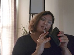 Big beautiful woman (BBW) uses leather cigarette case to give smoking fetish handjob